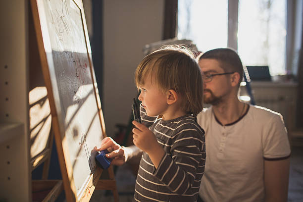 istock Dad and son together paint. soft focus, lifestyle, 629954376