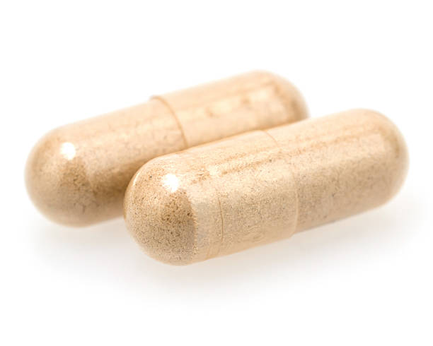 istock closeup of pills isolated on white background 629954892