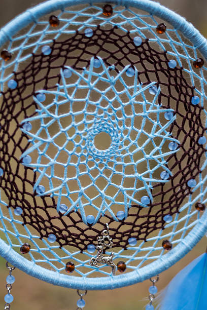 istock Dreamcatcher made of feathers, leather, beads, and ropes 629955616