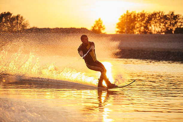 istock Man water skiing at sunset 629956376