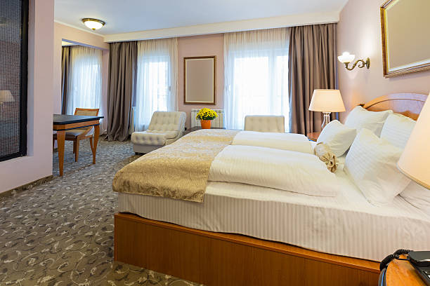 istock Interior of a new hotel double bed bedroom 629957350