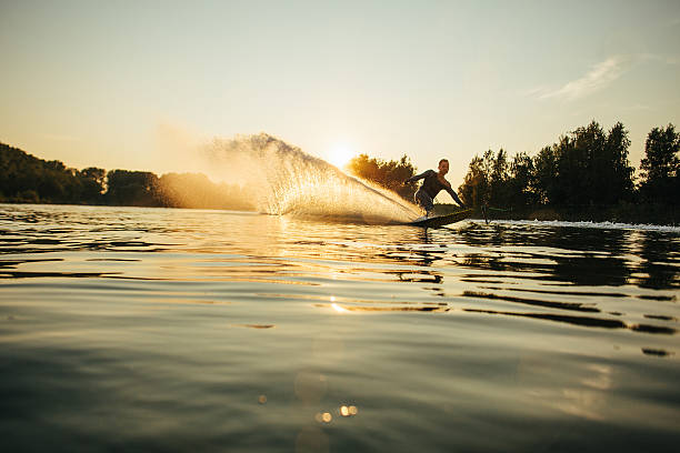istock Wakeboarder moving fast in splashes of water 629957676