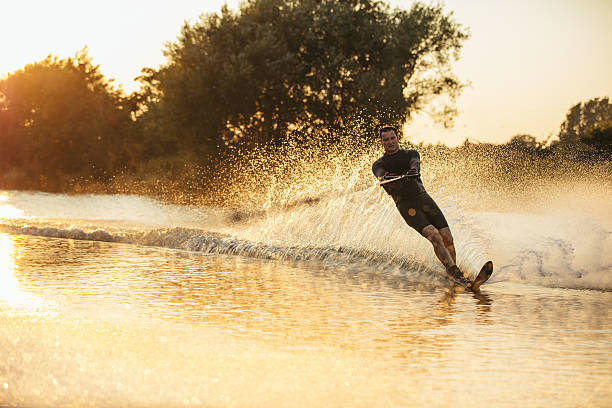 istock Wakeboarder surfing across the lake 629957992