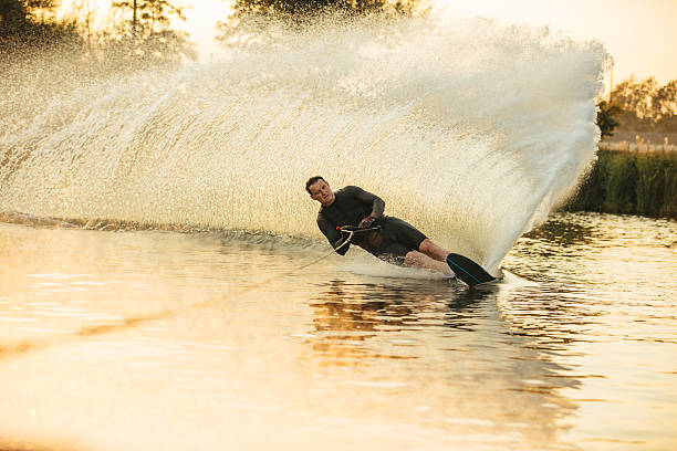 istock Wakeboarding on a lake with splashes 629958108