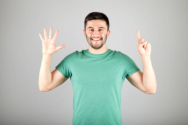 istock Man showing number by fingers 629959974