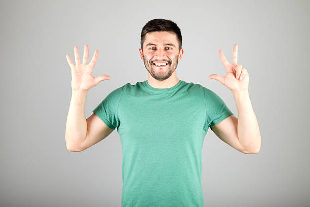 istock Man showing number by fingers 629960070