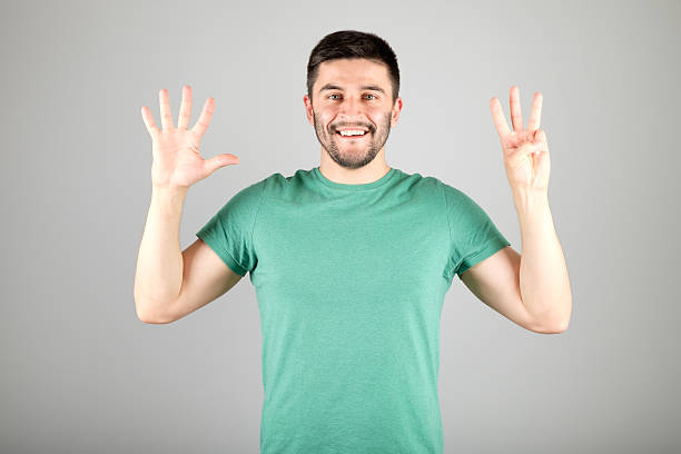 istock Man showing number by fingers 629960114