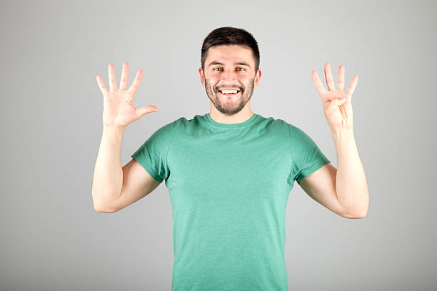 istock Man showing number by fingers 629960166
