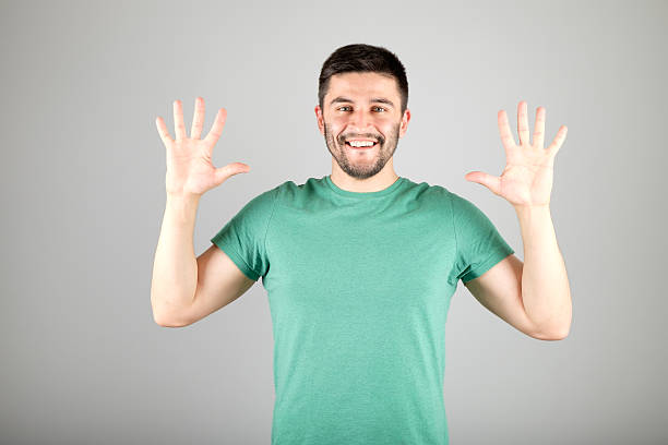 istock Man showing number by fingers 629960198