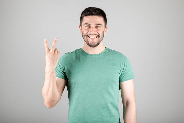 istock Man showing number by fingers 629960254
