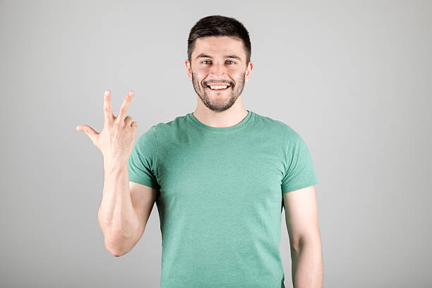 istock Man showing number by fingers 629960296