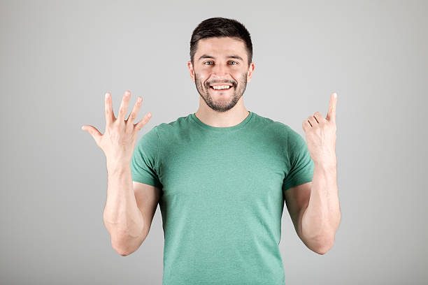 istock Man showing number by fingers 629960454