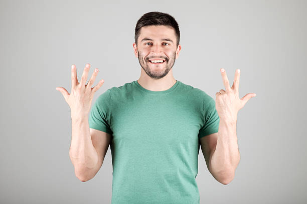 istock Man showing number by fingers 629960582