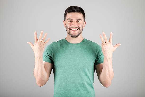 istock Man showing number by fingers 629960634