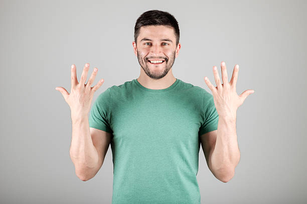istock Man showing number by fingers 629960668