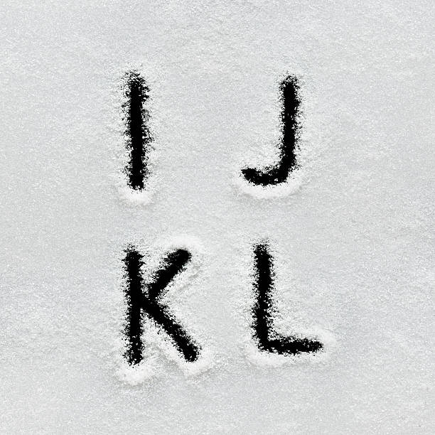 istock Winter alphabet, symbols and numbers hand written on snow. 629961326