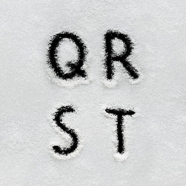 Winter alphabet, symbols and numbers hand written on snow. Winter alphabet, symbols and numbers hand written on snow. Black background isolated. Letters Q, R, S, T. pics of a letter t in cursive stock pictures, royalty-free photos & images