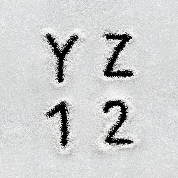 istock Winter alphabet, symbols and numbers hand written on snow. 629961638
