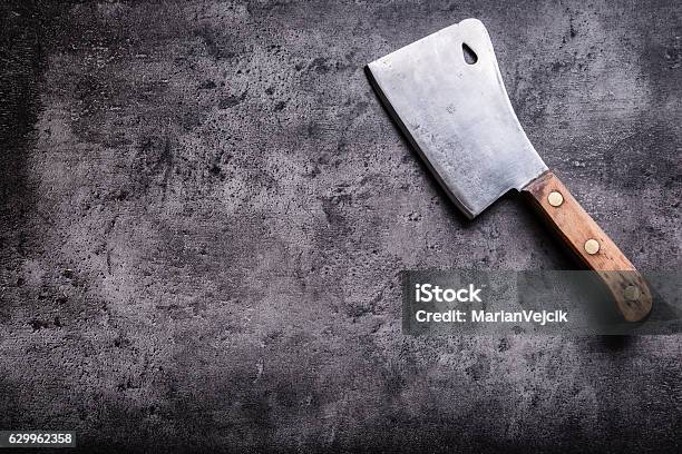 Vintage Butcher Meat Cleavers On Concrete Or Wooden Board Stock Photo - Download Image Now