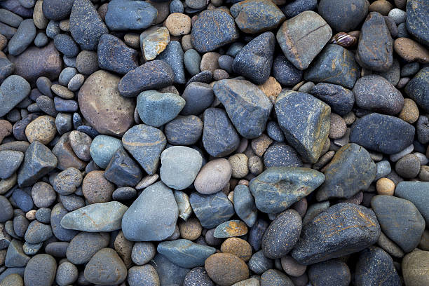 istock Natural blue stone on the beach background, 629963116