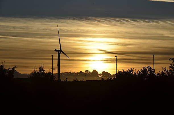 istock Sunset over a wind turbine in Bootle, UK. 629964422