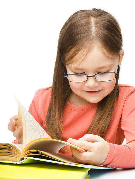 istock Little girl is reading a book 629965552