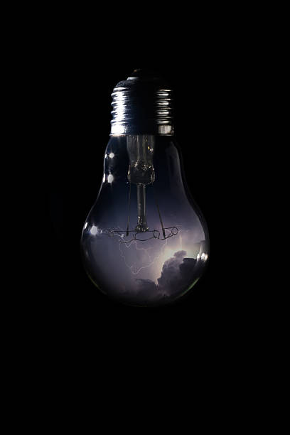istock Thunder and storm inside of light bulb on dark background 629984446