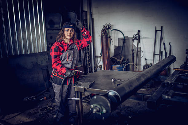 istock Girl welder in workshop 629985724