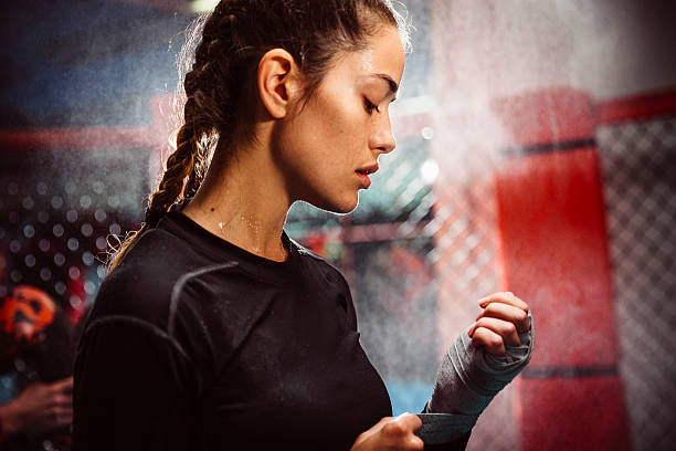 She Prepares Her Hands For Fighting Stock Photo - Download Image Now -  Boxing - Sport, Women, Preparation - iStock