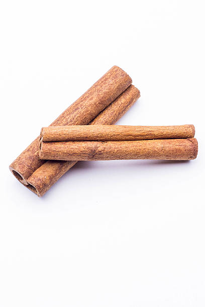istock Top view of cinnamon sticks isolated on white 629997178