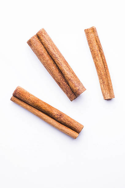 istock Top view of cinnamon sticks isolated on white 629997278