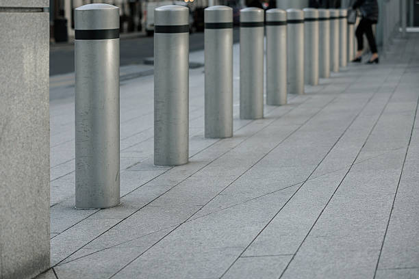 istock Row of gray Sidewalk columns 629998222