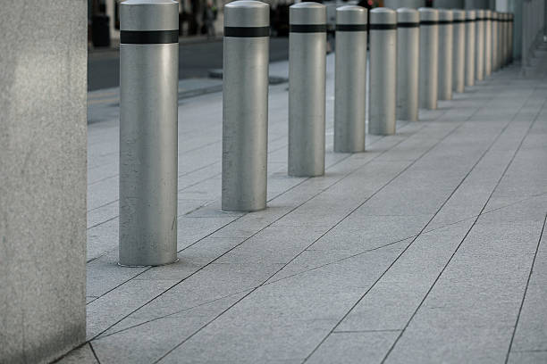 istock Row of gray Sidewalk columns 629998274