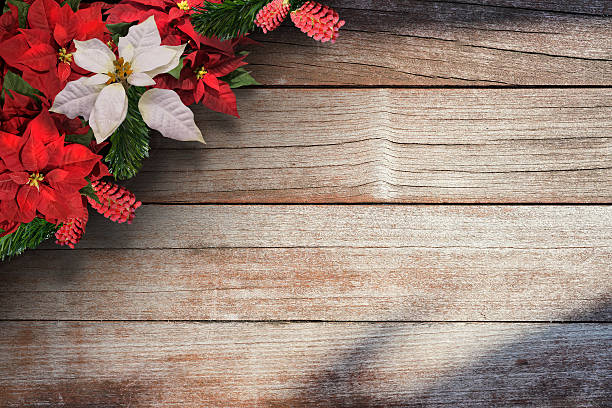 Christmas floral background border over the wooden plank