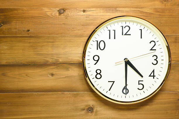 istock wall clock on the wooden wall 629998890