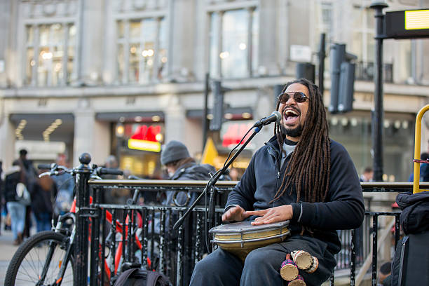 Reggae singer with jembe at urban street