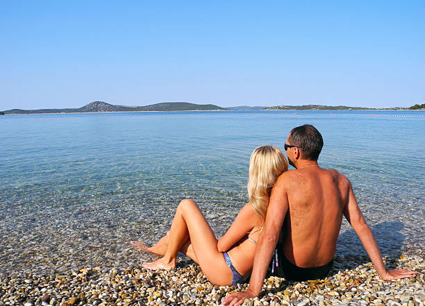 Loving couple near the sea in summer.