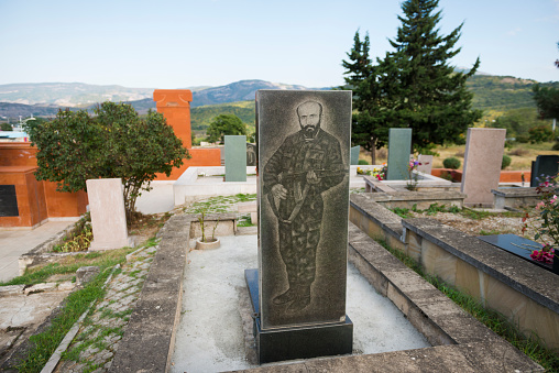 Stepanakert, Nagorno-Karabakh, Azerbaijan - September 22, 2016: An etched headstone marks the grave of a soldier of the Nagorno-Karabakh War at a cemetery in Stepanakert, the capital of the Nagorno-Karabakh Republic.