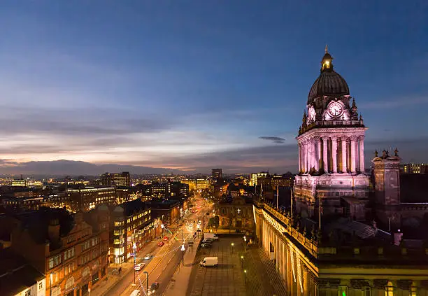 High angle view of Leeds Town Hall and panoramic night view of skyline, showing The Headrow and centre of the city.