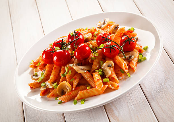 istock Penne with pesto sauce and vegetables 630021442