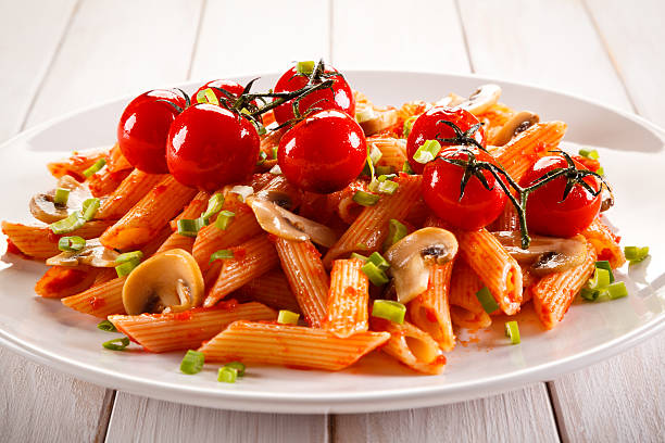 istock Penne with pesto sauce and vegetables 630021506