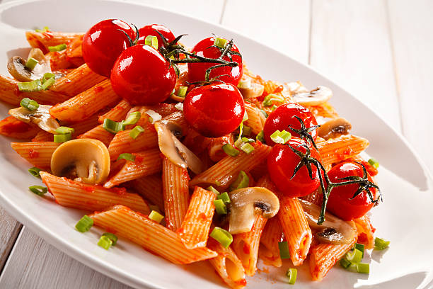 istock Penne with pesto sauce and vegetables 630021564