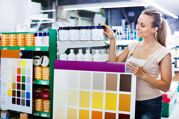 istock Woman choosing color for painting using palette scheme 630021954