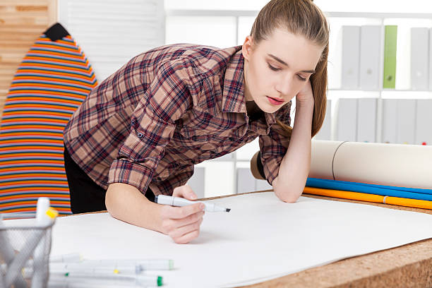 istock Woman designer with a surfboard 630023484