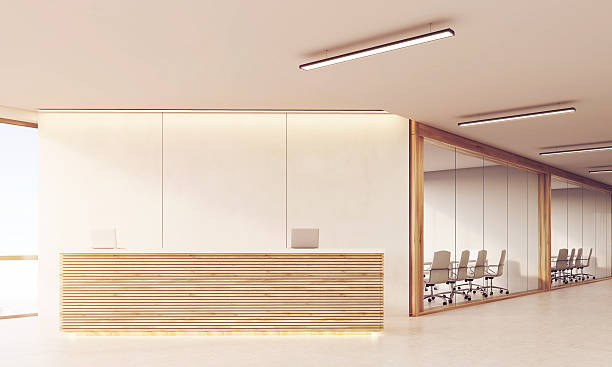 istock Front view of reception desk in long sunlit corridor 630023580