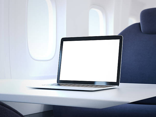 istock Laptop on the table in airplane cabin. 3d rendering 630039632
