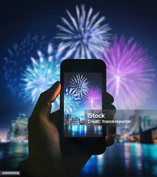 Smartphone Take A Pic Of The Nyc Celebration Stock Photo - Download Image Now - Firework Display, Firework - Explosive Material, Smart Phone