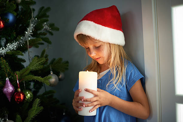 istock Cute girl with candle 630040208