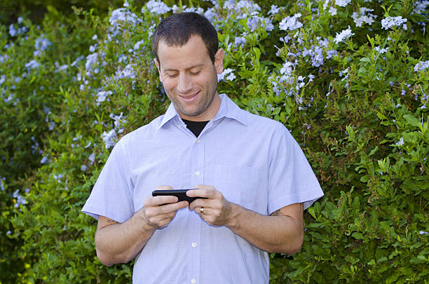 istock Man playing games on phone. 630041618