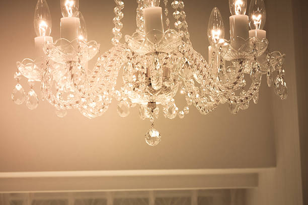 istock Crystal glass glittering chandelier,cross processed colors. 630048892
